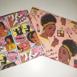 May include: Two pink zippered pouches with a comic book and beauty theme. One pouch features a black woman with a yellow headband and the text "Beauty Queen". The other pouch features a comic book style design with the words "Party", "Dance", and "Wow".