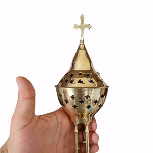 Incense burner made from brass with small plate to hold charcoal and incense