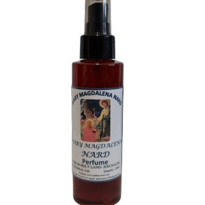 May include: A dark red perfume bottle with a black spray nozzle. The label reads "MARY MAGDALENA NARD Perfume" with an image of religious figures. The bottle contains 120ml of perfume.