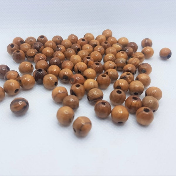 Perles en bois d'olivier 10mm fabriquées à la main à Bethléem pour faire un chapelet 500 grains
