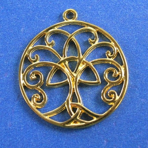 May include: Gold-toned metal pendant featuring a Celtic knot design in the shape of a tree of life. The pendant is circular and has a delicate, intricate design.