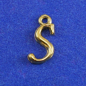 May include: Gold-colored metal letter S charm with a loop at the top for attaching to a necklace or bracelet.