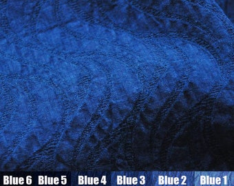 May include: A close-up of a textured blue fabric swatch with six different shades of blue labeled from darkest to lightest: "Blue 6", "Blue 5", "Blue 4", "Blue 3", "Blue 2", and "Blue 1".  The Chinese characters for each shade are also included.