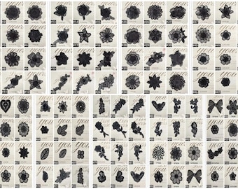 May include: A collection of black lace appliques in various floral and decorative designs. Each applique is displayed on a white card with the words "your" and "you" in cursive script. The appliques include flowers, leaves, and bow shapes.