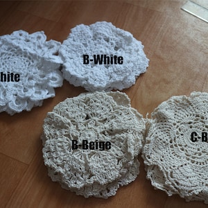 May include: Three crocheted doilies, one white, one beige, and one off-white. The white doilies are labeled "A-White" and "B-White". The beige doily is labeled "C-Beige" and "B-Beige".
