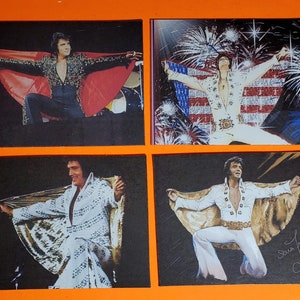 May include: Four different images of Elvis Presley in a white jumpsuit with a cape. The images show Elvis in different poses, including with his arms outstretched and kneeling. The images are in black and white and have a vintage feel.