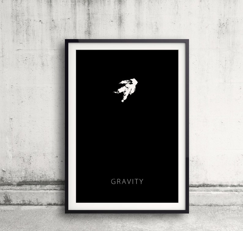 astronaut floating in dark space. text: "Gravity"