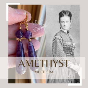 May include: Amethyst gemstone earrings with gold accents. The earrings feature a teardrop shape with a round bead at the top. The earrings are displayed against a hand and a vintage photograph of a woman.