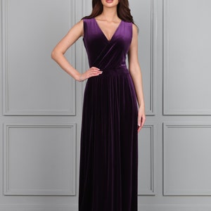 aubergine velvet sleeveless long dress.
A dress has a Wrap V- neck
 Closed back
 Sleeveless
 Waistband, waist sash
 High wrap leg slit
 Pleats
 Floor length