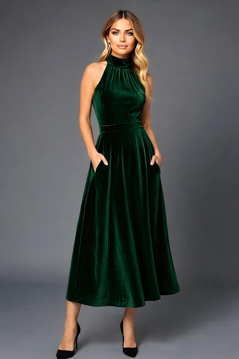 emerald velvet halter midi dress with pockets, sleeveless design with halter neckline a line style
