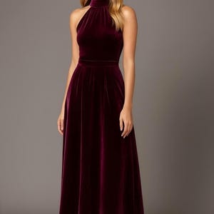 burgundy velvet halter midi dress with pockets, sleeveless design with halter neckline a line style
