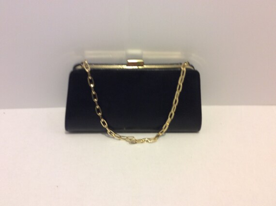 black handbag with gold chain
