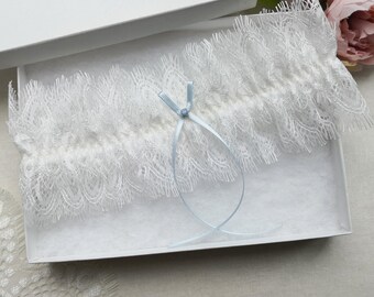 Ivory lace wedding garter, bridal garter with blue bow and opal, blue garters for wedding