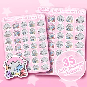 May include: Two sticker sheets featuring cartoon illustrations of a gray seal, a moon, and colorful paint drips. The text "punny moon" and "Luna has an art fail" are at the top. A sticker reads "35 cute planner stickers!"