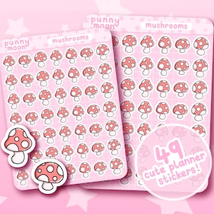 May include: A set of 49 pink and white mushroom planner stickers. The stickers are arranged in a grid pattern on a pink background. The text "punny moon" and "mushrooms" is printed on the sheet. The text "49 cute planner stickers!" is printed on a white circle.
