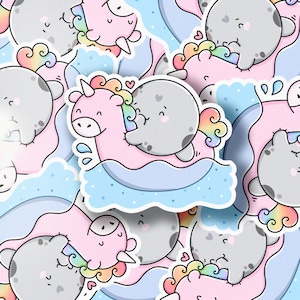May include: A set of colorful stickers featuring cartoon walruses riding on unicorns. The stickers have a whimsical and playful design with pastel colors and rainbow accents.