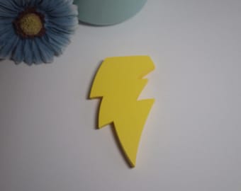 May include: A yellow lightning bolt shape cut out of felt.