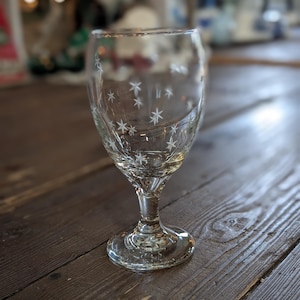 May include: A set of three ceramic mugs with a speckled, matte finish in cream, light grey, and dark grey. Each mug has a simple, minimalist design and a rounded handle.