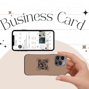 May include: A brown phone case with a black QR code printed on it. The case is being held by a hand in front of a white wooden background. The phone case is designed to fit a smartphone with a triple lens camera.