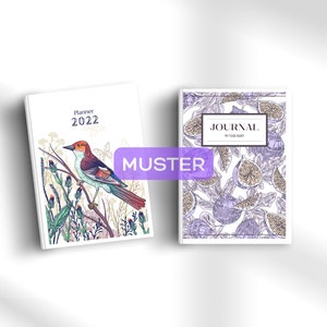 May include: Two book covers with different designs. The left cover features a colorful bird perched on a branch with flowers and leaves. The text on the cover reads "Planner 2022". The right cover features a purple and white pattern of figs. The text on the cover reads "JOURNAL MY FOOD DIARY".