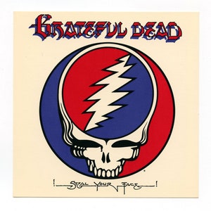 May include: A vintage Grateful Dead sticker featuring the band's iconic skull and lightning bolt logo in red, white, and blue colors. The text "Steal Your Face!" is written below the logo.