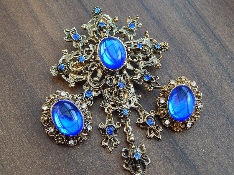 electric blue fleur de lis style brooch and clip on earrings set