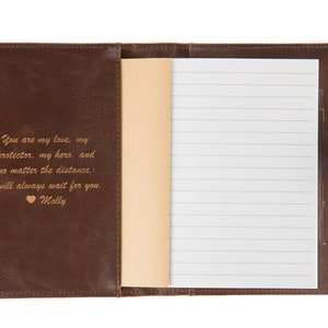 May include: Brown leather-bound journal with a gold inscription that reads "You are my love, my protector, my hero, and no matter the distance, I will always wait for you. Molly".