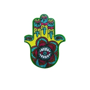 以下が含まれることがあります： 中央に青い目を持ち、黄色、ピンク、緑のディテールで囲まれたカラフルなハmsaの手。