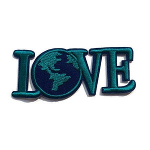 May include: A teal blue embroidered patch with the word "LOVE" in large letters. The "O" is replaced with a blue and green globe.
