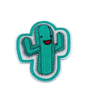 May include: A green embroidered cactus patch with a smiling face and white stitching around the edges.