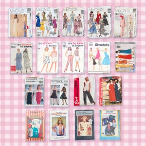 May include: A collection of fourteen assorted sewing pattern envelopes from brands including McCall's, Simplicity, and Butterick. Each rectangular paper envelope displays illustrations of clothing designs, model photographs, and printed text labels.