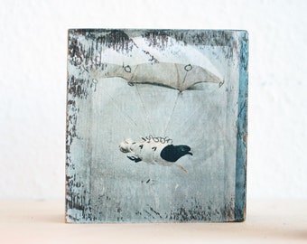 Carrier pigeon on a parachute, upcycling old wooden beams, photo on wood, 8 x 8 cm