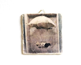Photography dove with parachute made of travertine stone tile, with hook for hanging