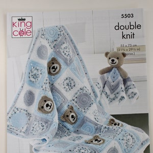 May include: A crochet pattern for a baby blanket and a small bear toy. The blanket is blue, white, and grey, with bear faces. The pattern is double knit, and the blanket measures 55 x 75 cm.