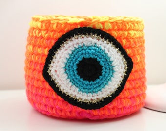 Neon Crochet Evil Eye Basket, quirky storage basket in bright yarn with handmade eye of protection motif