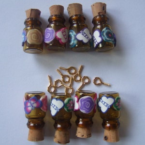 May include: Set of 10 small glass bottles with cork stoppers. Each bottle is decorated with colorful butterflies and flowers. The bottles come with gold jump rings for hanging.