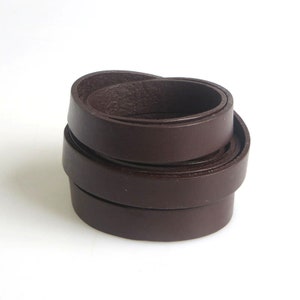 May include: A roll of dark brown leather straps, perfect for crafting projects.