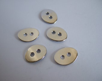 May include: Five silver oval-shaped buttons with two holes each.
