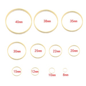 May include: Assortment of 10 gold jump rings in various sizes, ranging from 8mm to 40mm in diameter.