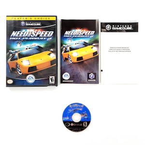 May include: A complete Nintendo GameCube game set of Need for Speed: Hot Pursuit 2. The set includes the game case, instruction booklet, game disc, and a precautions booklet. The game case features a yellow sports car.