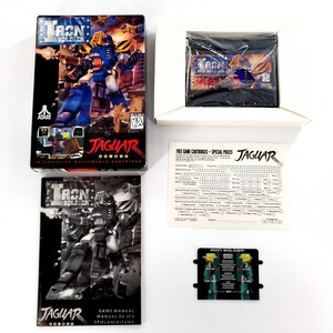 May include: Iron Soldier video game for Atari Jaguar, including the original box, game cartridge in a plastic sleeve, instruction manual, a registration card, and a controller overlay. The box features a blue and yellow robot illustration.