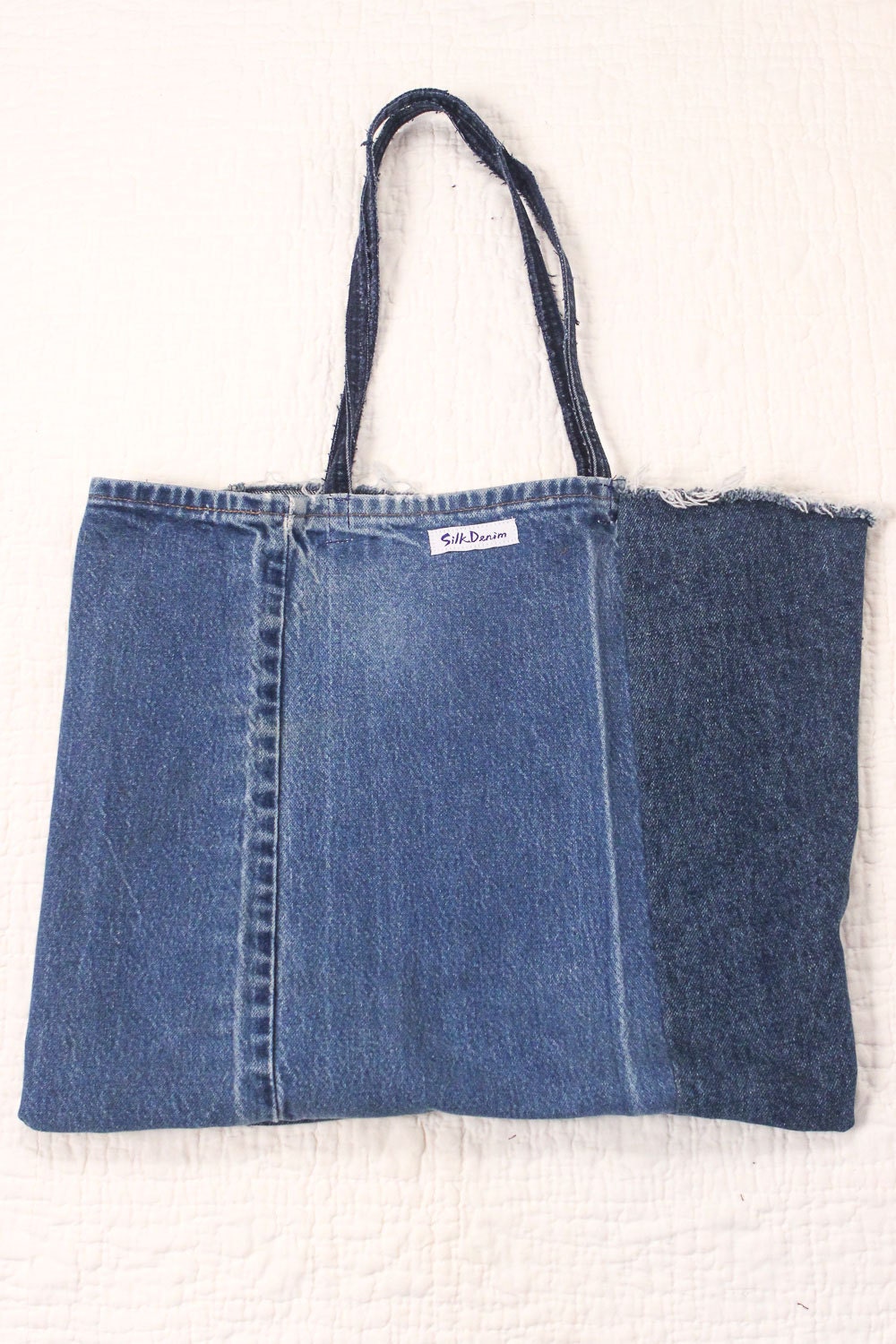 The Week-End Tote bag is fashioned from Monogram Washed Denim