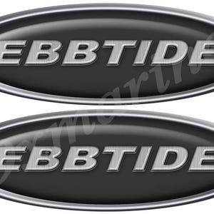 May include: Two oval-shaped emblems with the word "EBBTIDE" in a textured, silver font. The text is set against a dark gray background, framed by a shiny silver border. The design is simple and modern.