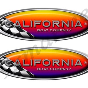 May include: Two oval-shaped decals with a gradient background of orange, red, and purple. The text "CALIFORNIA BOAT COMPANY" is displayed in silver. A checkered flag design is on the left side, and a silver border surrounds the oval.