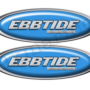 May include: Two oval-shaped decals with a blue background and silver trim. The word "EBBTIDE" is in silver, bold, sans-serif font. Below, in smaller text, is "POWER BOATS". The decals are likely for a boat.