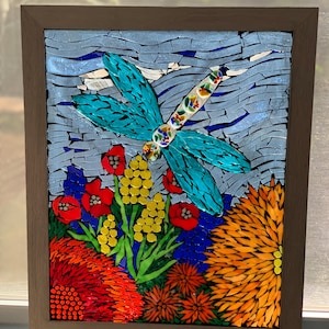 Stained glass mosaic dragonfly in the garden suncatcher