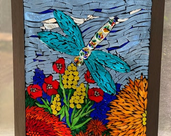 Stained glass mosaic dragonfly in the garden suncatcher