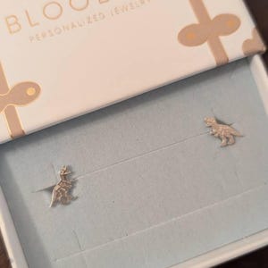 Customer photo, T-Rex Fossil Stud Earrings