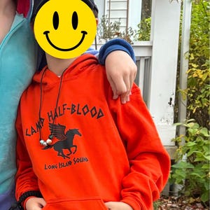Felpa Con Cappuccio Percy Jackson - Camp Half Blood - TV Series - Book Week 2025 - Arancione