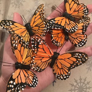 Fake Butterflies | Fake Monarch | Burgundy Feather Monarch Butterflies - 1  3/4in. - 12 Pieces/Pkg. (pm60911208)